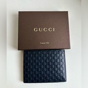 Gucci Men’s Bifold Wallet (Guccissima Leather)